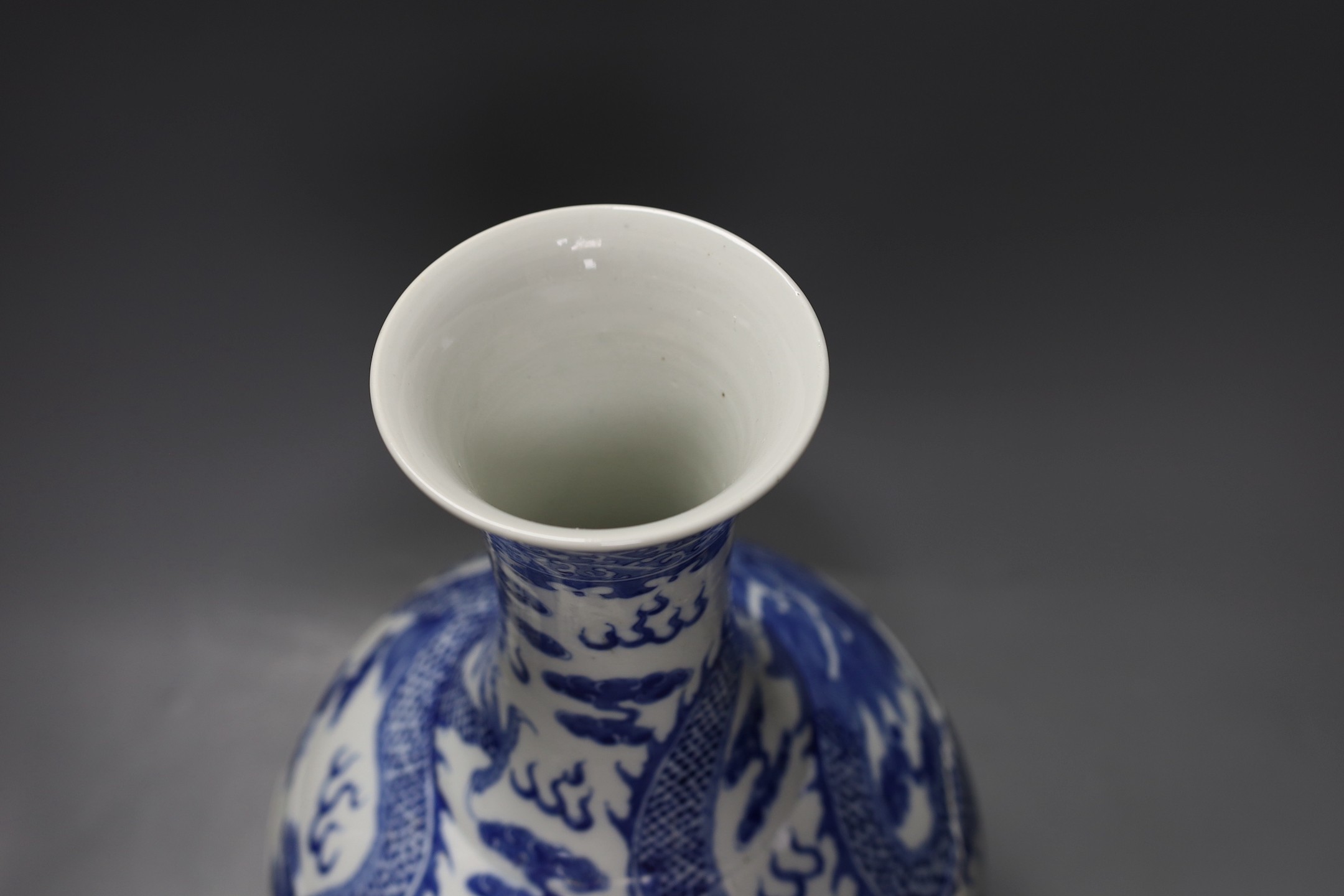 A large Chinese blue and white vase, damaged, 38cm